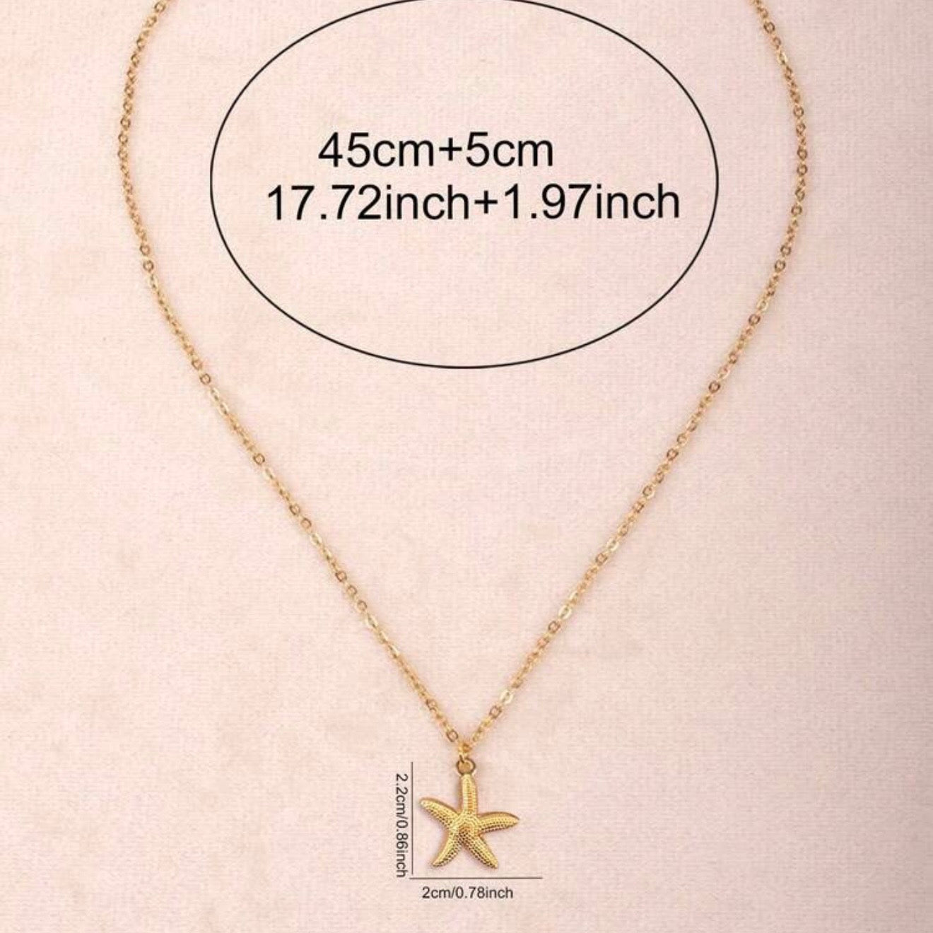 Gold starfish pendant necklace on a delicate gold-plated chain