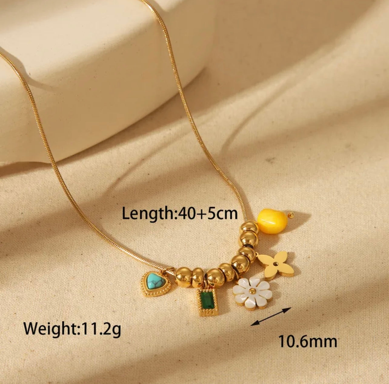 Gold Plated Chain with Flower, Heart, and Gem Pendants
